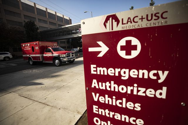 A fire department medical truck accesses the emergency parking lot of the LAC USC Hospital amid the coronavirus pandemic in Los Angeles.